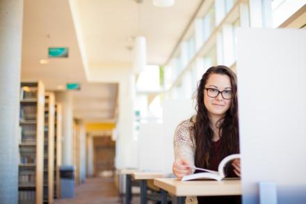 Student reading a book in the Nanaimo campus library