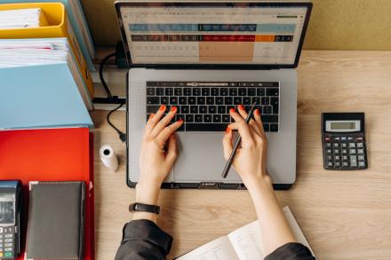 computer, hands typing, calculator